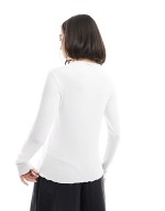 ribbed long sve top with lettuce edge detail in white